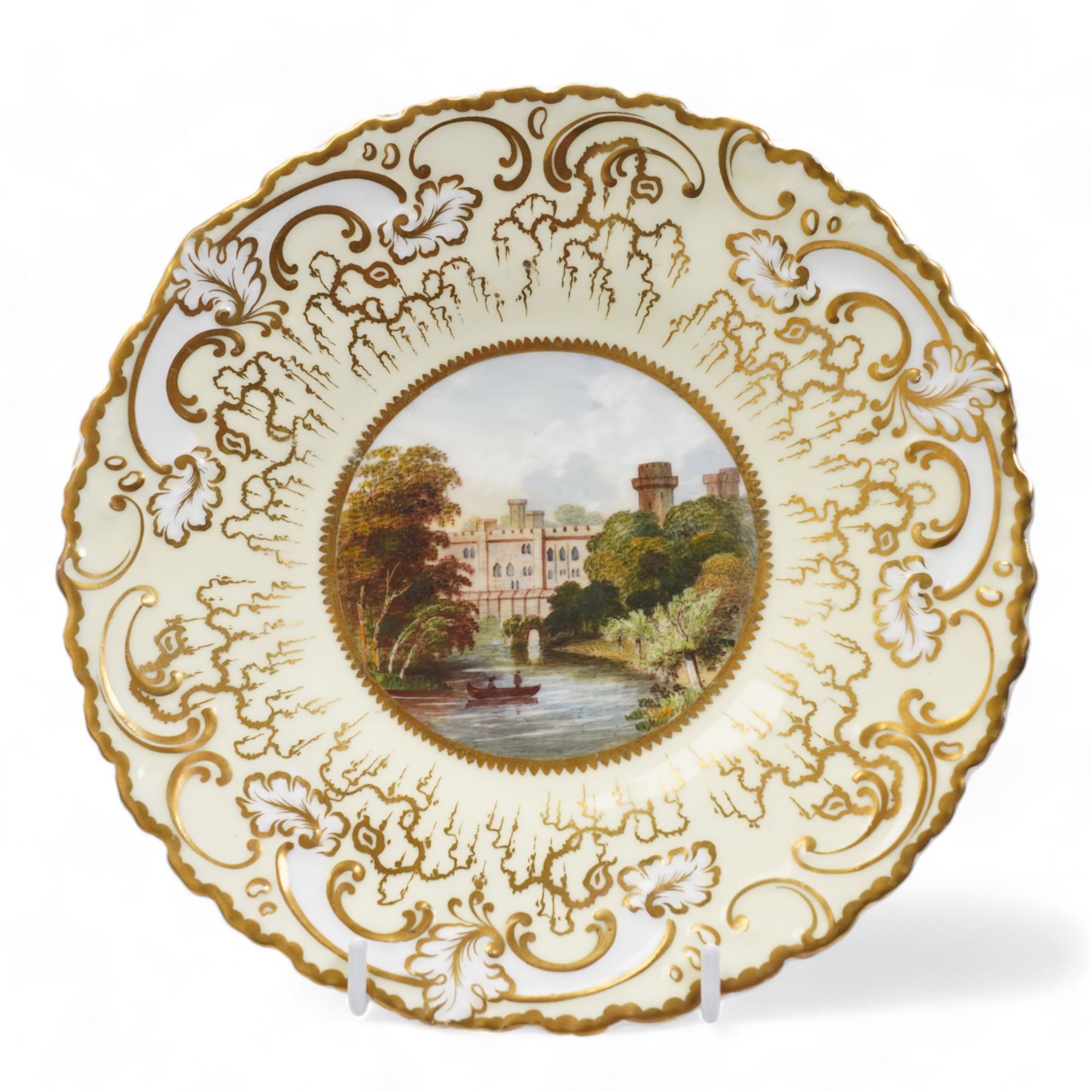 H&R Daniel Queen's shape porcelain plate, centrally painted with Blarney Castle, within a polychrome floral painted border, titled beneath, D25cm and another plate painted with a view of Warwick Castle (2)