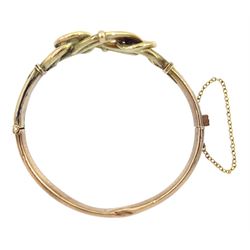 Early 20th century rose gold knot design hinged bangle, stamped 9ct