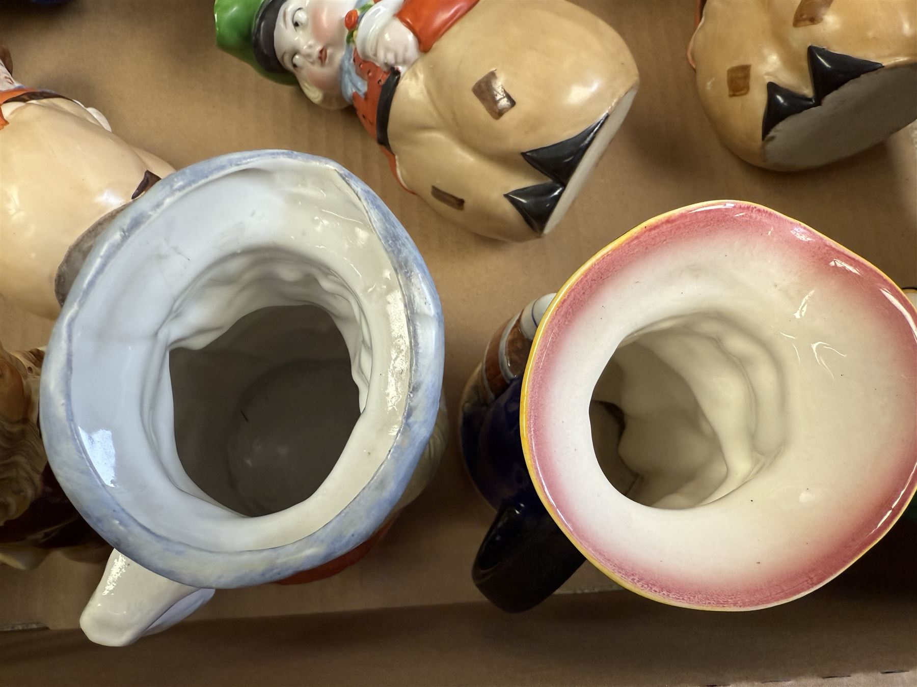 19th century ceramic toby jug with gold anchor mark to base, together with a collection of other toby jugs, tallest H21cm