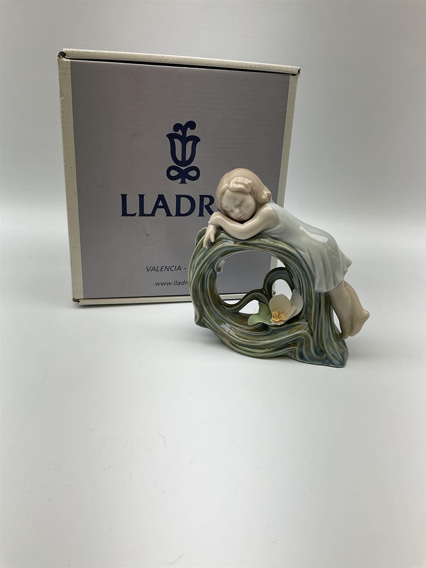 Collection of seven Lladro figures, including Seated ballerina with swan 6204, Childhood Dream 8129, Dancer 5050, reclining clown with ball alongside a selection of other figures. 