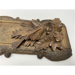 Late 19th/early 20th century Black Forest style book slide, the supports carved with birds upon a nest containing eggs amidst foliage, retracted L45.5cm