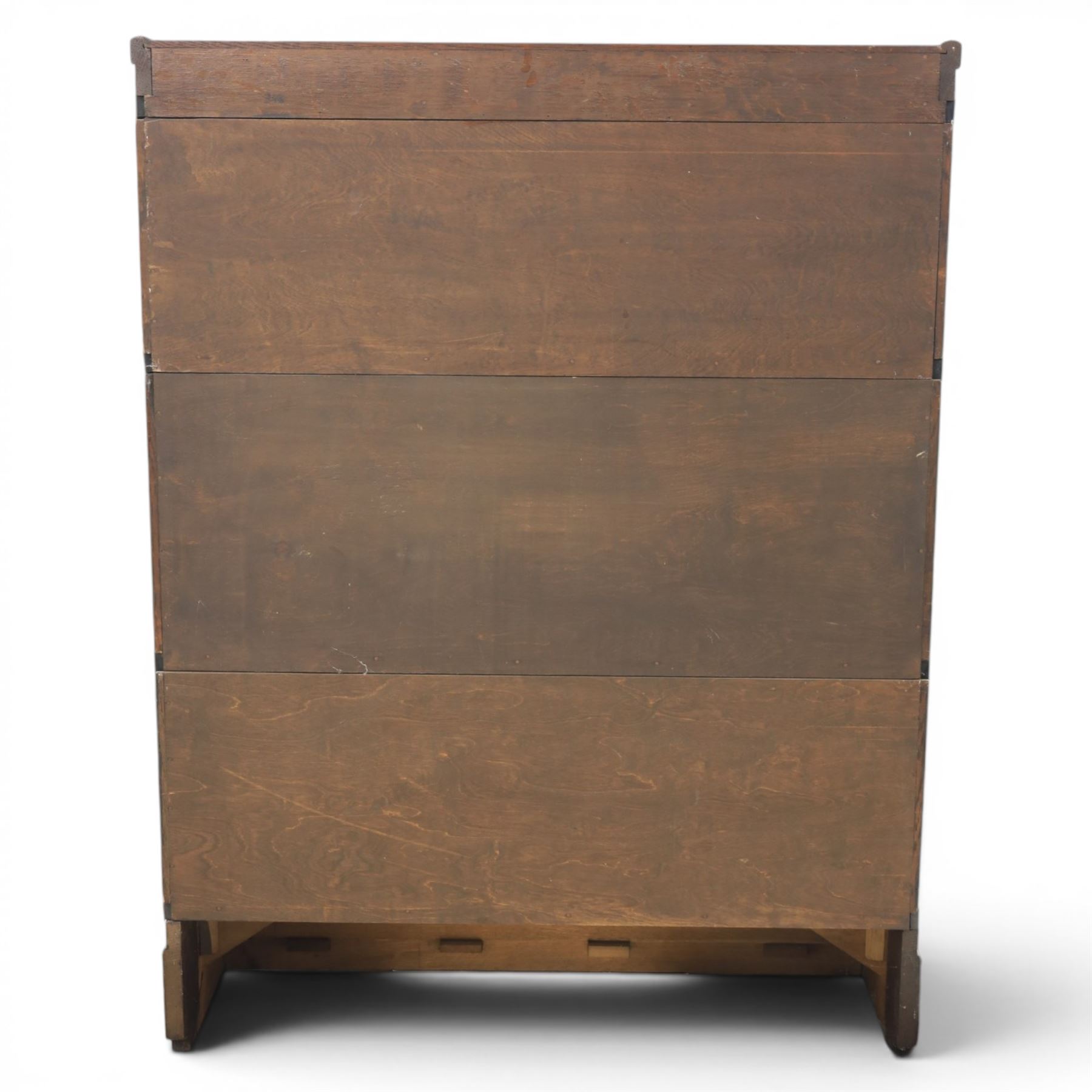 Globe Wernicke - early 20th century oak stacking bookcase, three tiers, lift up glazed doors raised on a plinth base