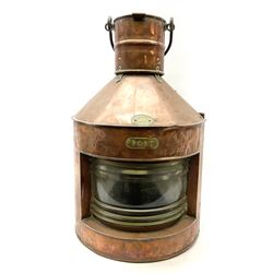 Large ship's copper 'Port' lamp by Griffiths & Sons Birmingham No.8211 of bow-fronted triangular form with iron swing handle, threaded mounting bracket and associated oil burner with clear glass chimney and reflector H57cm excluding handle