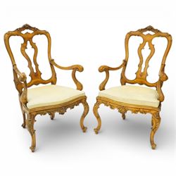 Pair of Italian carved walnut open armchairs, upholstered seats