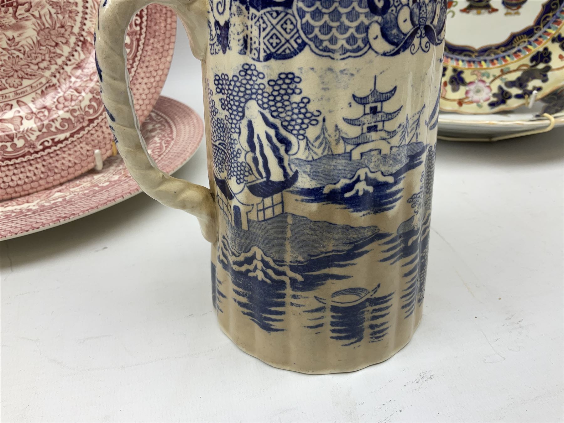 Four mid 19th century Mason's Ironstone plates decorated in the Chinese Antiquities pattern, the central circular panel decorated with footed vase with stylised motifs within a floral border, with gilt detail, pattern no. 1438, largest D26cm, together with Royal Worcester plate with floral decoration within green borders, blue and white tankard with pewter lid and teapot, teapot
