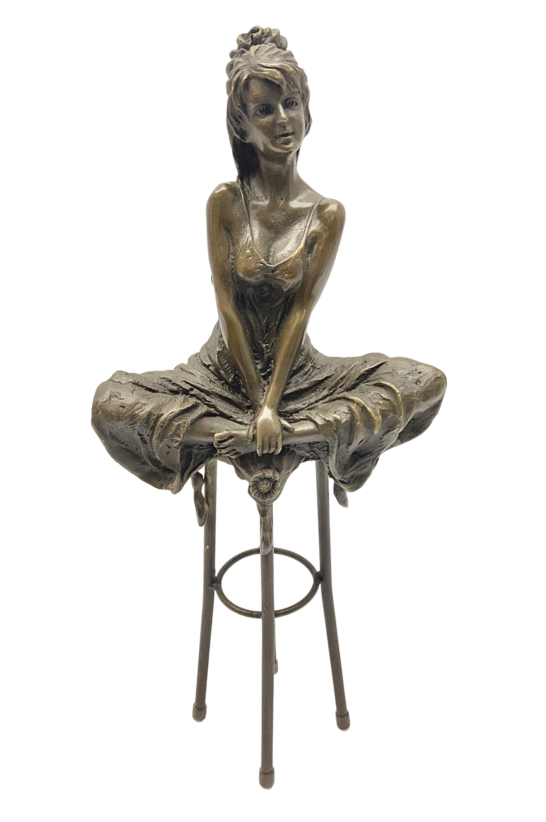 Art Deco style bronze modelled as a female figure seating crossed legged upon a chair, after Pierre Collinet, H28cm