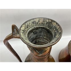 Two Middle Eastern or Persian copper ewer, tallest example H45cm 