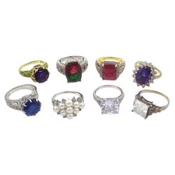 Eight silver and silver-gilt stone set dress rings including cubic zirconia dress rings, pearl cluster and mystic topaz ring, all stamped 925