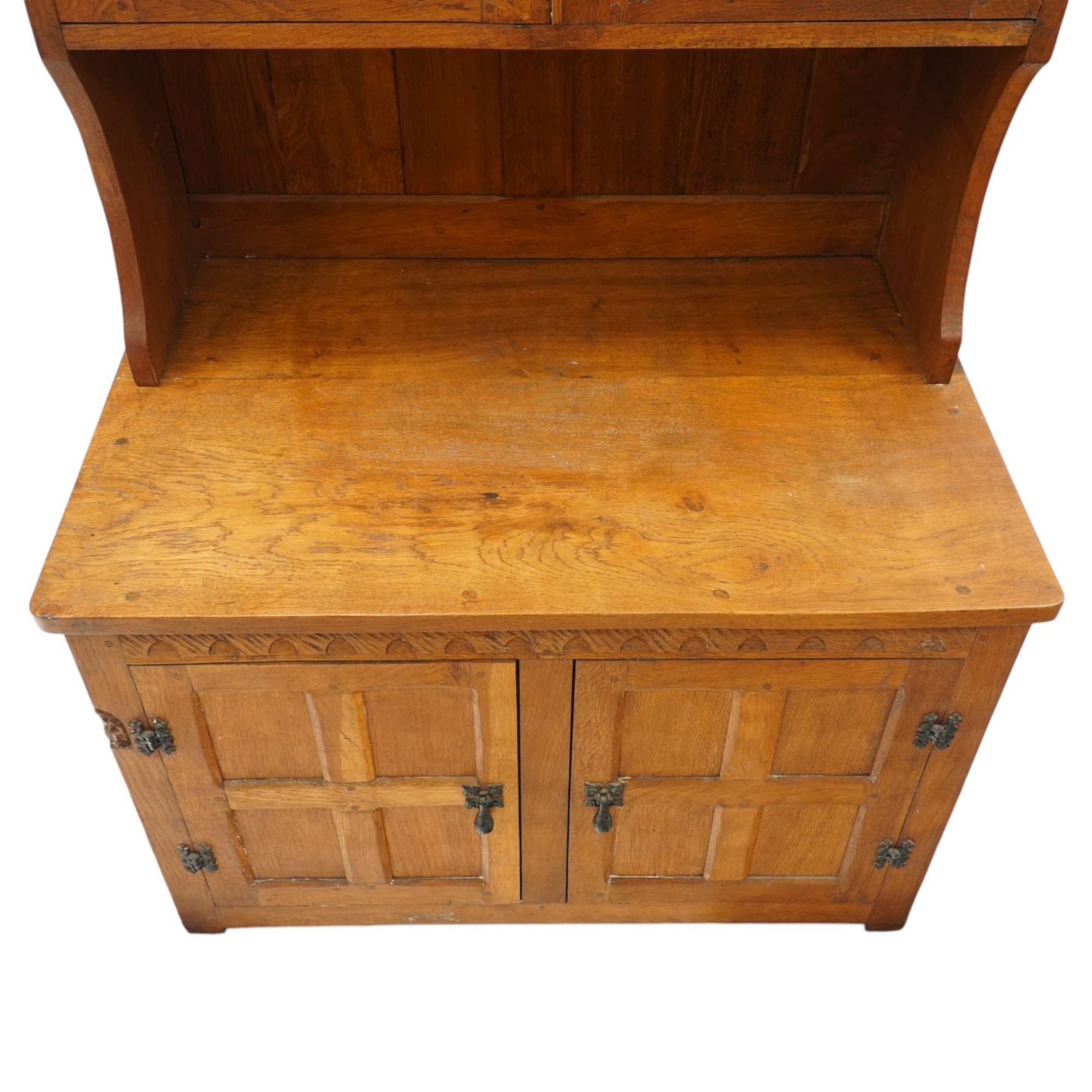 Gnomeman - adzed oak dresser, arcade carved cresting rail over two lead glazed doors, double cupboard below enclosed by two panelled doors, with carved gnome signature, by Thomas Whittaker of Littlebeck 