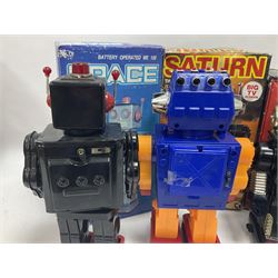Three vintage battery operated robots comprising tin-plate Space Walk Man ME 100 Robot, Saturn the 13