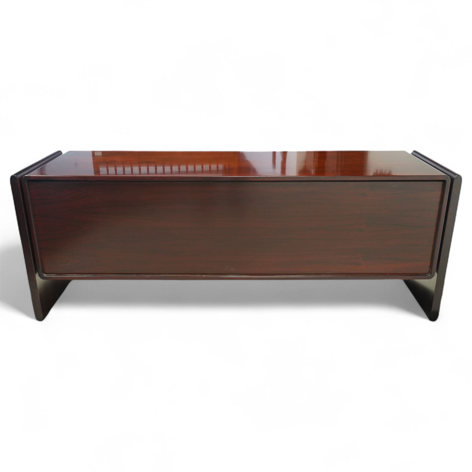 Dyrlund  - contemporary Santos rosewood office sideboard of minimalist form with clean lines, rectangular top with integrated side supports, left side with two drawers, and right side with a filing drawer, all enclosed by sliding doors


Note: Dyrlund is a Danish furniture manufacturer known for its high-quality, handcrafted pieces, particularly in the mid-century modern style. Founded in 1960 by Frits Hjerte Dyrlund in Rude, Denmark, the company has remained a family business, now run by the second and third generations. Dyrlund specializes in both home and executive office furniture, focusing on practicality, solid construction, and classic design. 
