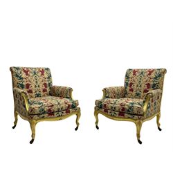 William Bertram & Son of London - pair late 19th century giltwood armchairs, moulded frame with scroll carved back and arm terminals, upholstered in striped fabric with foliate pattern, on shell carved cabriole supports, the brass castors stamped 