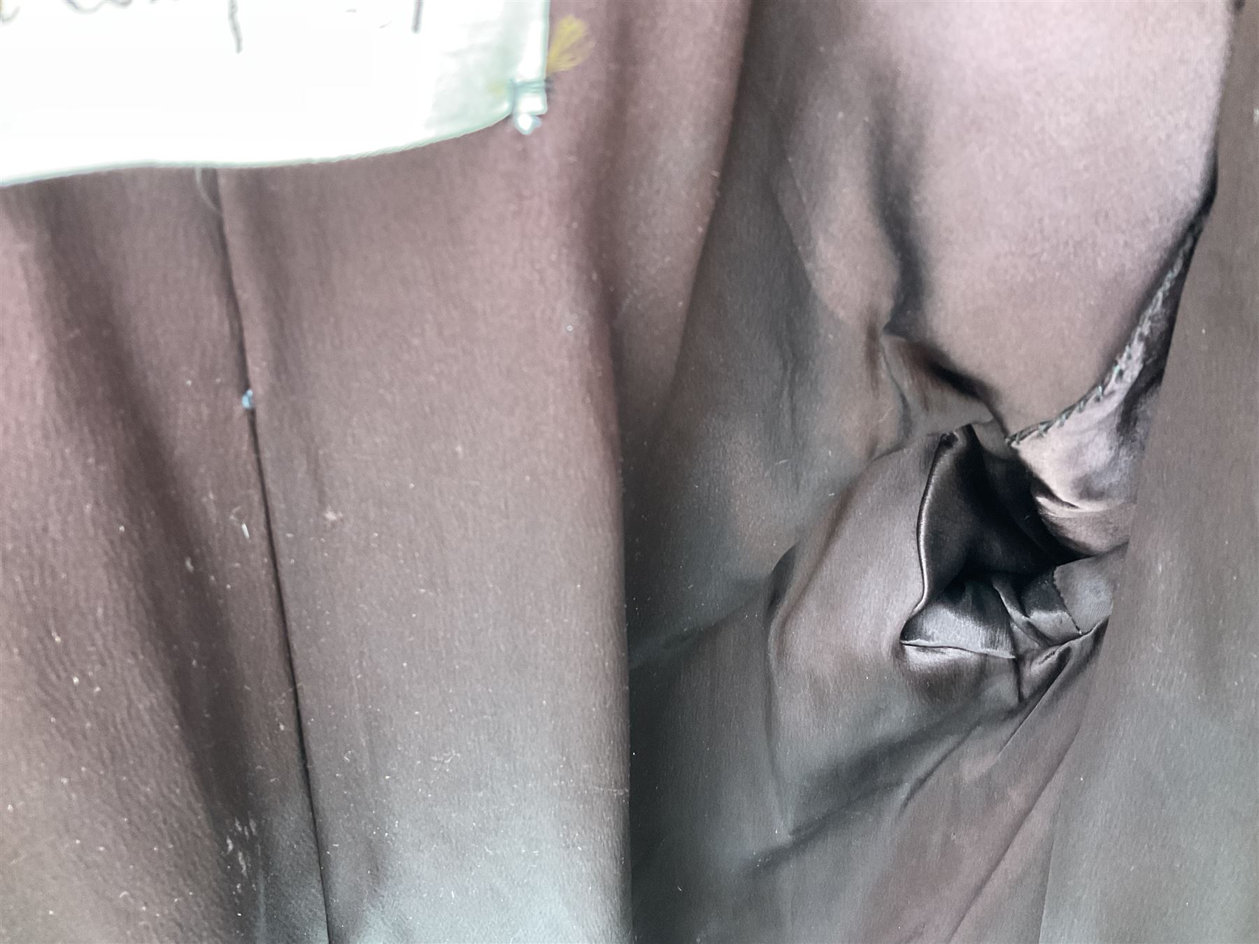 Brown mid length musquash fur coat by National Fur Company together with white rabbit cape