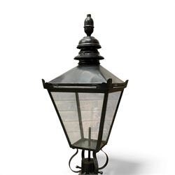 Victorian-style cast iron lamp post in a black finish,
