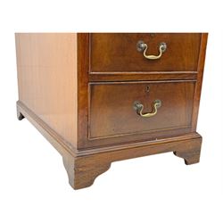 Edwardian mahogany twin pedestal desk, rectangular burgundy leather top moulded edge, over three short drawers with brass swan neck handles, over twin pedestals with graduating drawers supported on bracket feet