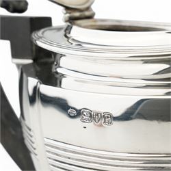 Late Victorian silver three piece tea set of panel sided oval design, the teapot with ebonised handle and lift, Chester 1898/99 Maker Florence Warden and William Aitken