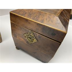 19th century burr yew wood tea caddy, of sarcophagus form, with strung details and brass mounts, the interior split into three compartments, upon four brass bun feet, together with an oak and brass bound writing slope, with red leather interior with gilt detailing, largest H16cm, W40cm