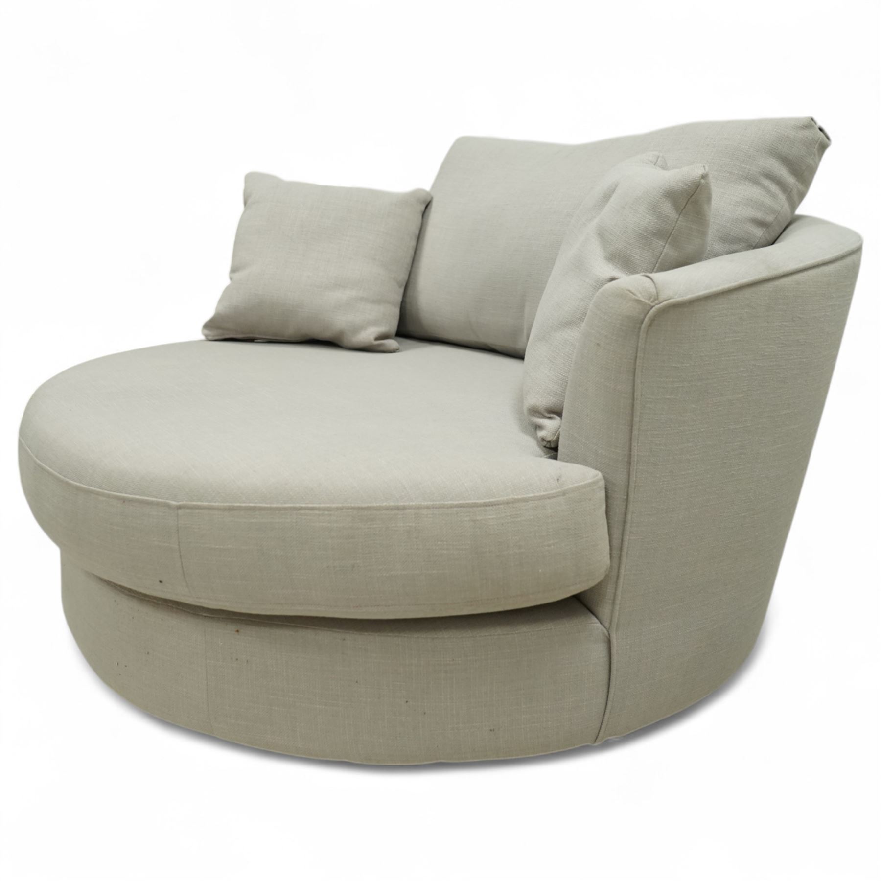 Contemporary circular snuggle chair, upholstered in taupe linen-effect fabric with fixed seat and loose back and scatter cushions, on concealed castors
