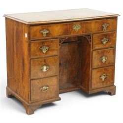 George III figured walnut kneehole desk, the rectangular top with feather and cross-bandin...