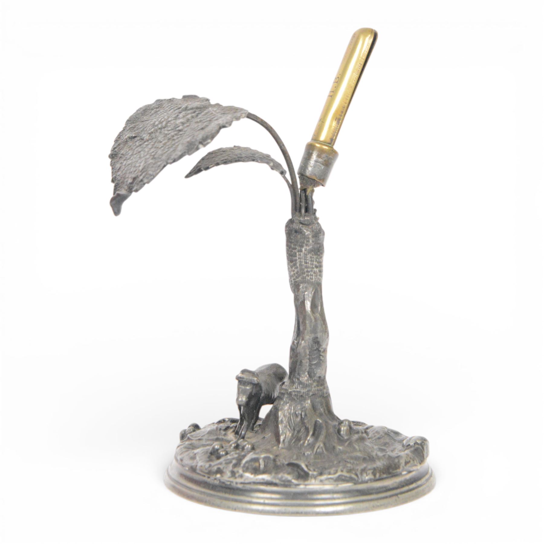 19th century silver plated desk holder, the circular naturalistically modelled base cast with fruiting vines and with applied figure of a ram, rising to a vine with two leaves, and initialled brass clip, H18cm