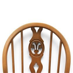 Ercol - Set of four dark elm 'Fleur De Lys' chairs