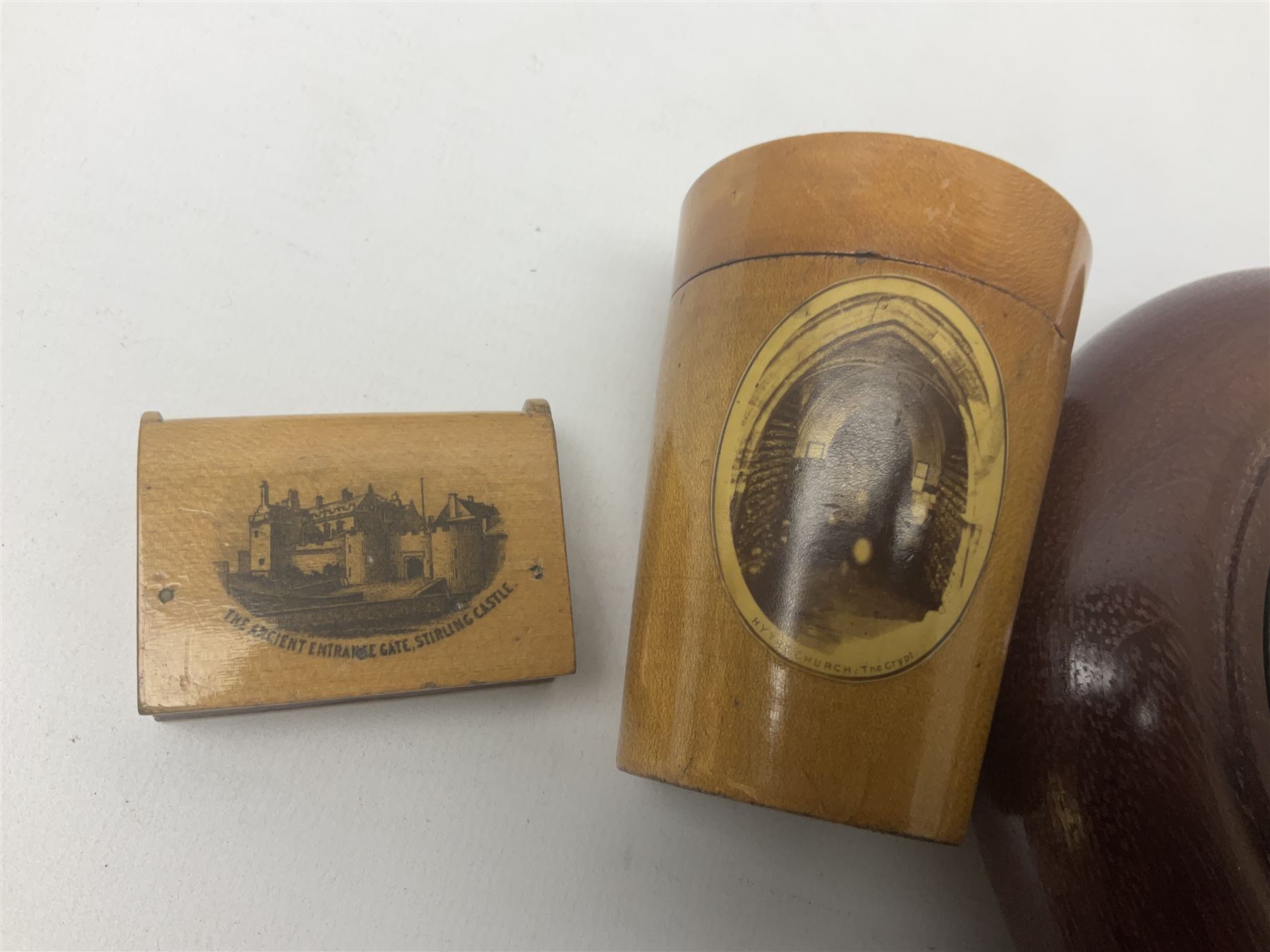 Two Mauchline ware boxes, comprising case modelled as a book depiciting The Ancient Entrance Gate, Stirling Castle, and lidded jar depicting Hythe Church, The Crypt, together with Russian lacquer box and other wood pot pourri bowl