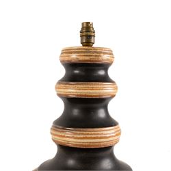 West German Pottery - two mid 20th century ceramic lamp bases, brown glaze with petal style decoration and pierced detail, together with another similar with volcanic glaze, largest H52cm