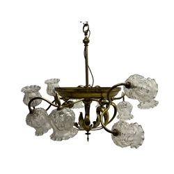 Mid-20th century brass lightolier or light fitting, the scrolling foliate branches connected with a central ring, terminating in ten tulip shaped cut glass sades, pointed terminal beneath
