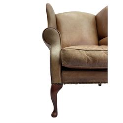 Georgian style wingback armchair, upholstered in tan leather, on cabriole front feet