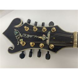 Eastern F-hole eight-string mandolin with black finish and mother-of-pearl inlay of a man riding a winged horse/unicorn amongst clouds and stars with playing card suits to the fingerboard L71cm