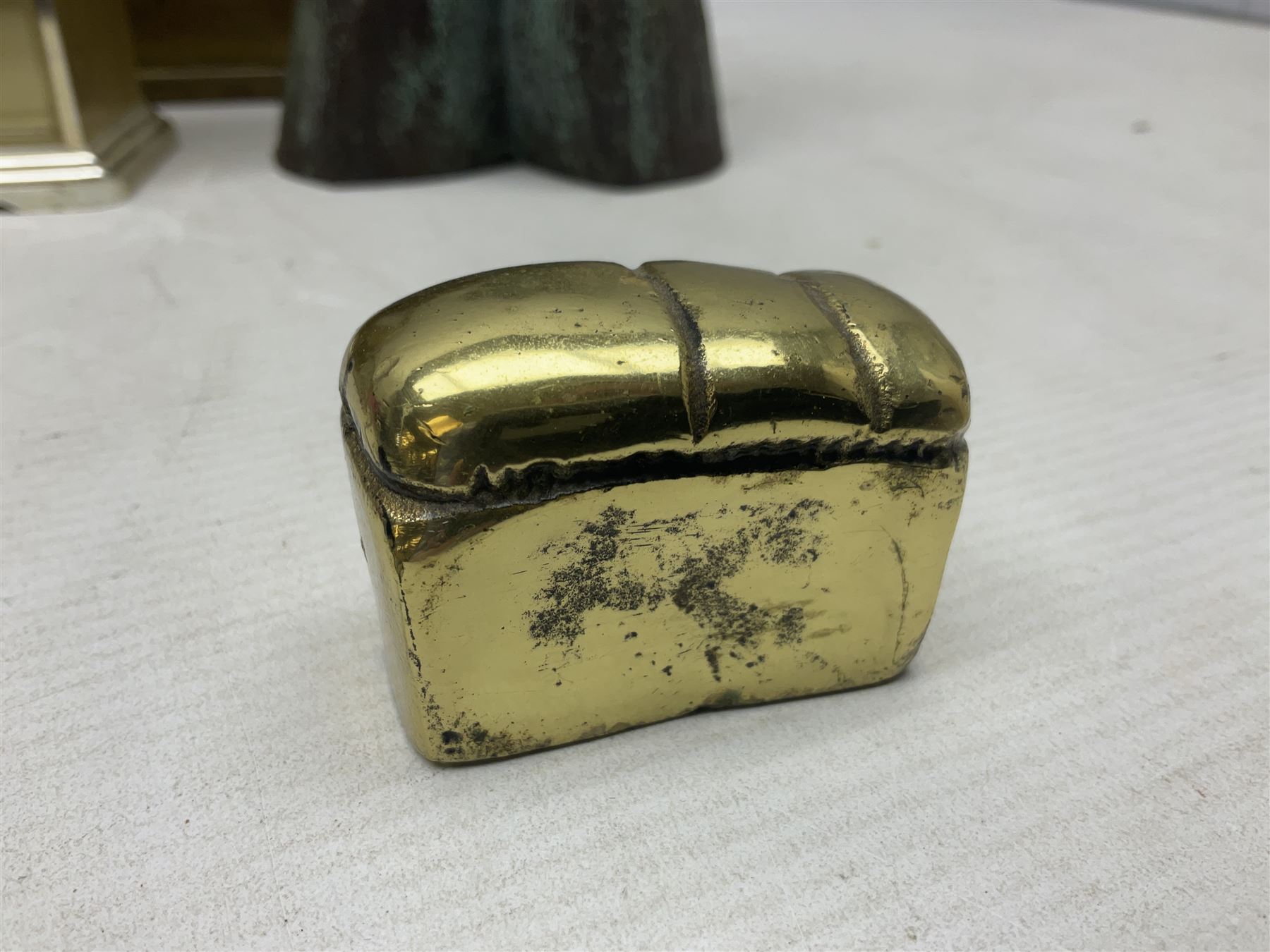 Metamec and H. Samuel battery operated brass carriage clocks, bronzed style abstract figure signed 'Cotp W', two art glass splash bowls, etc