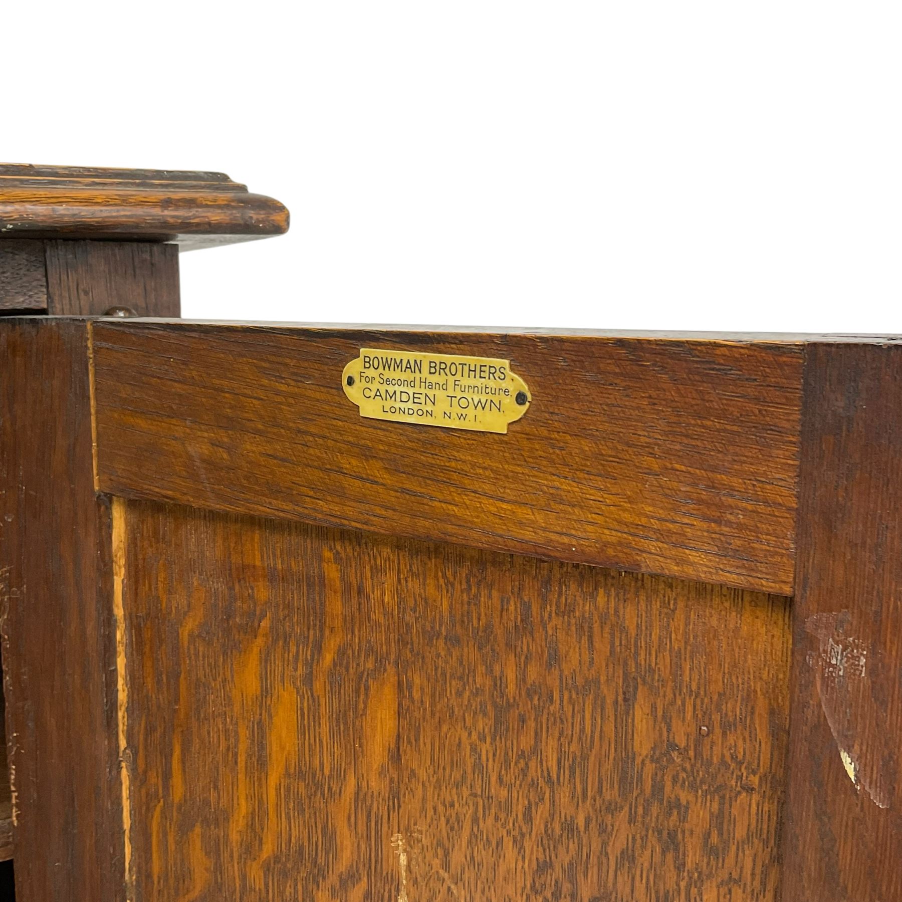 Early to mid-20th century oak dresser, raised two tier plate tack over two linenfold panelled doors, on spiral turned supports united by undertier 