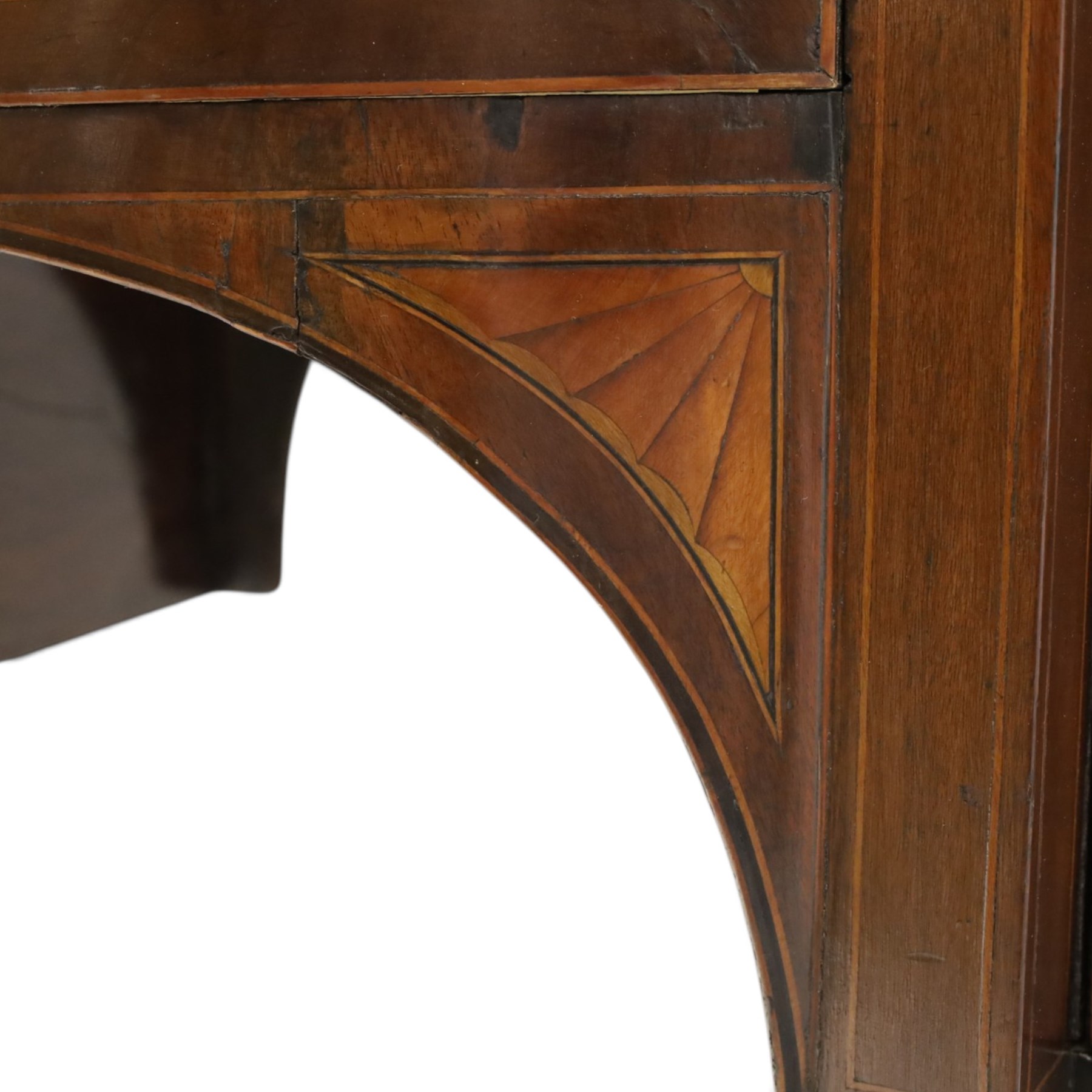 Regency period inlaid mahogany bow-breakfront sideboard, shaped rectangular top with crossbanding and ebony stringing, central convex frieze drawer flanked by cupboard and cellarette drawer, over fan-inlaid spandrels, raised on square tapering supports