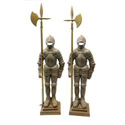 A matching pair of knights, fireside companions, holding halberds, H90cm. 