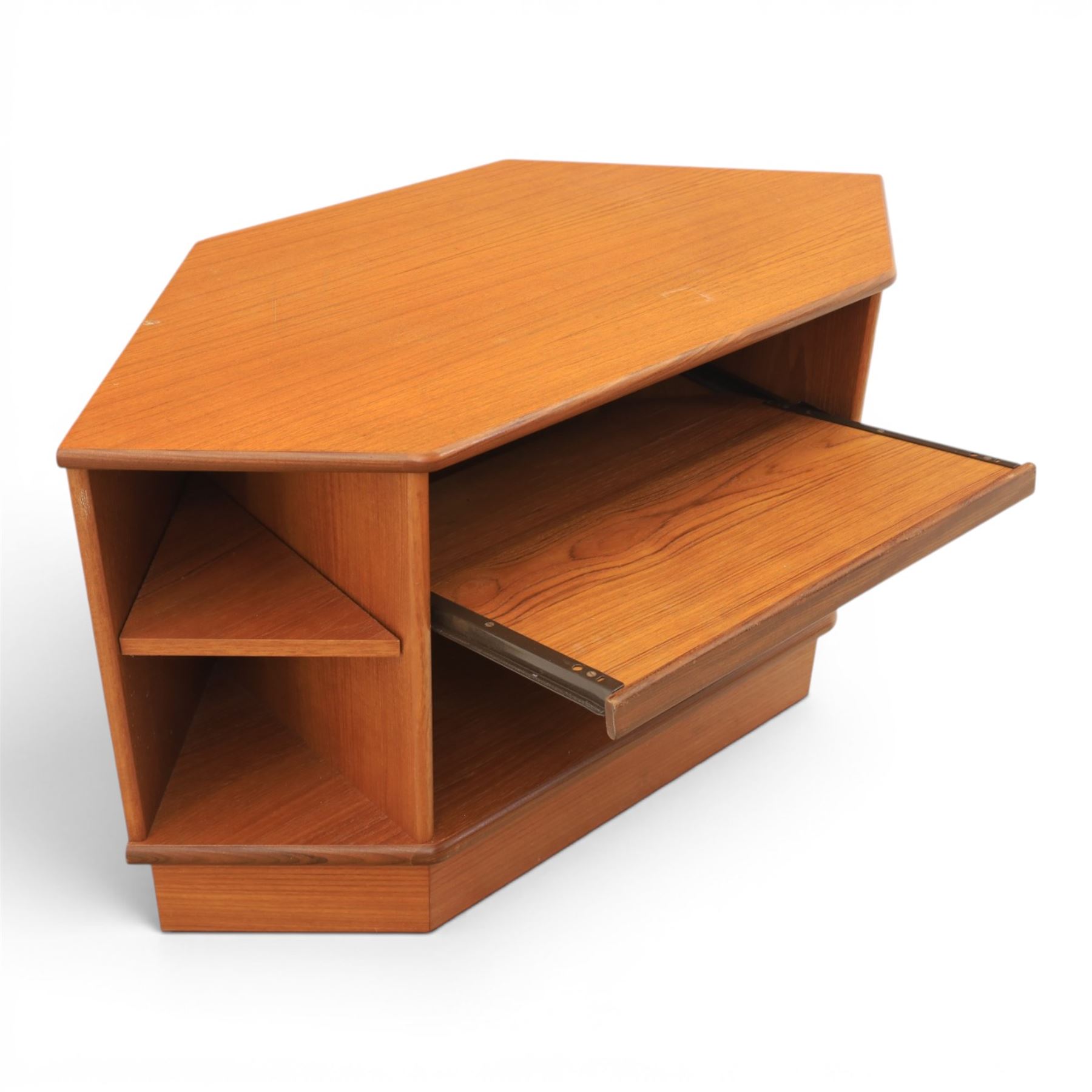 G-Plan - teak corner media unit, shaped top above a sliding central shelf above an open recess, flanked by further shelves, raised on a plinth base with a rear aperture for wires