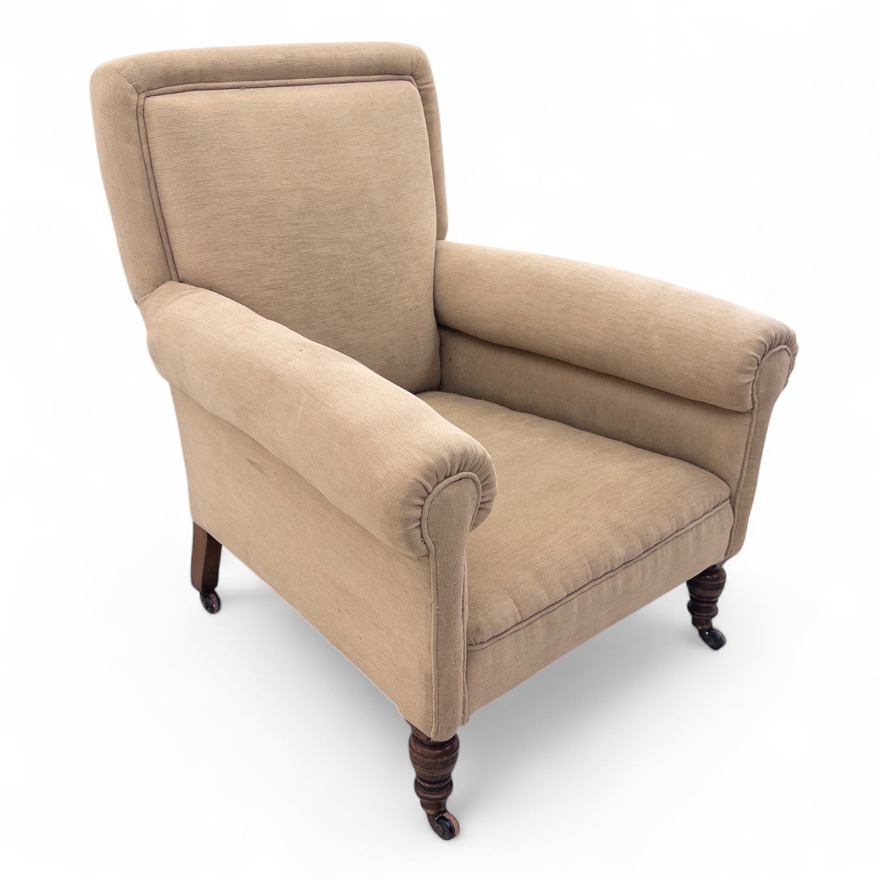 Late 19th century Howard style upholstered armchair, with deep seat and scroll arms, on turned front legs with brass and ceramic castors, the rear leg stamped Smith & Co Bristol No.302 