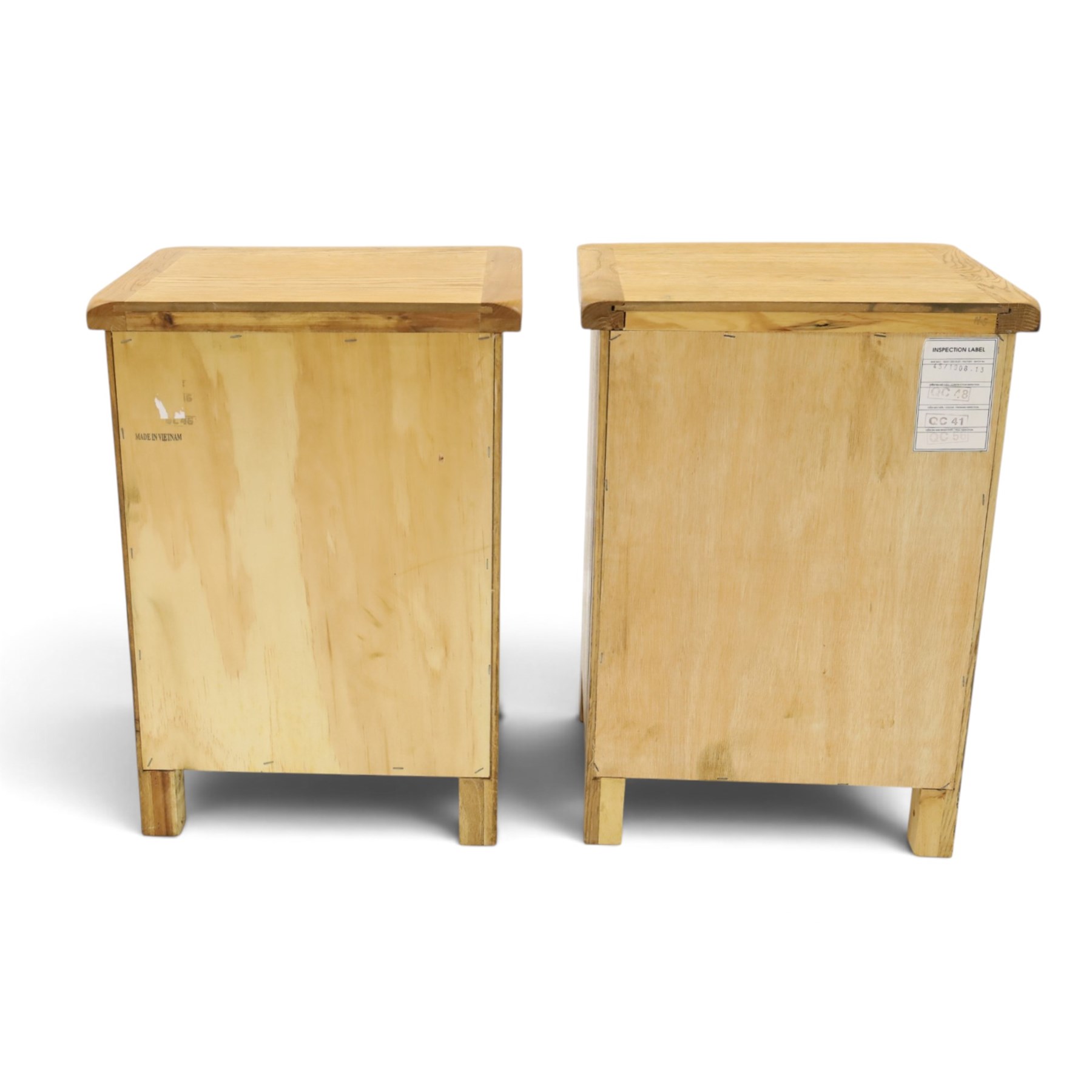 Pair of solid light oak bedside chests, rectangular top over three graduating drawers with metal handles and plates, on square feet