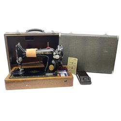 No.99 Singer sewing machine in case, with book, accessories, serial no EF 229971, 1949