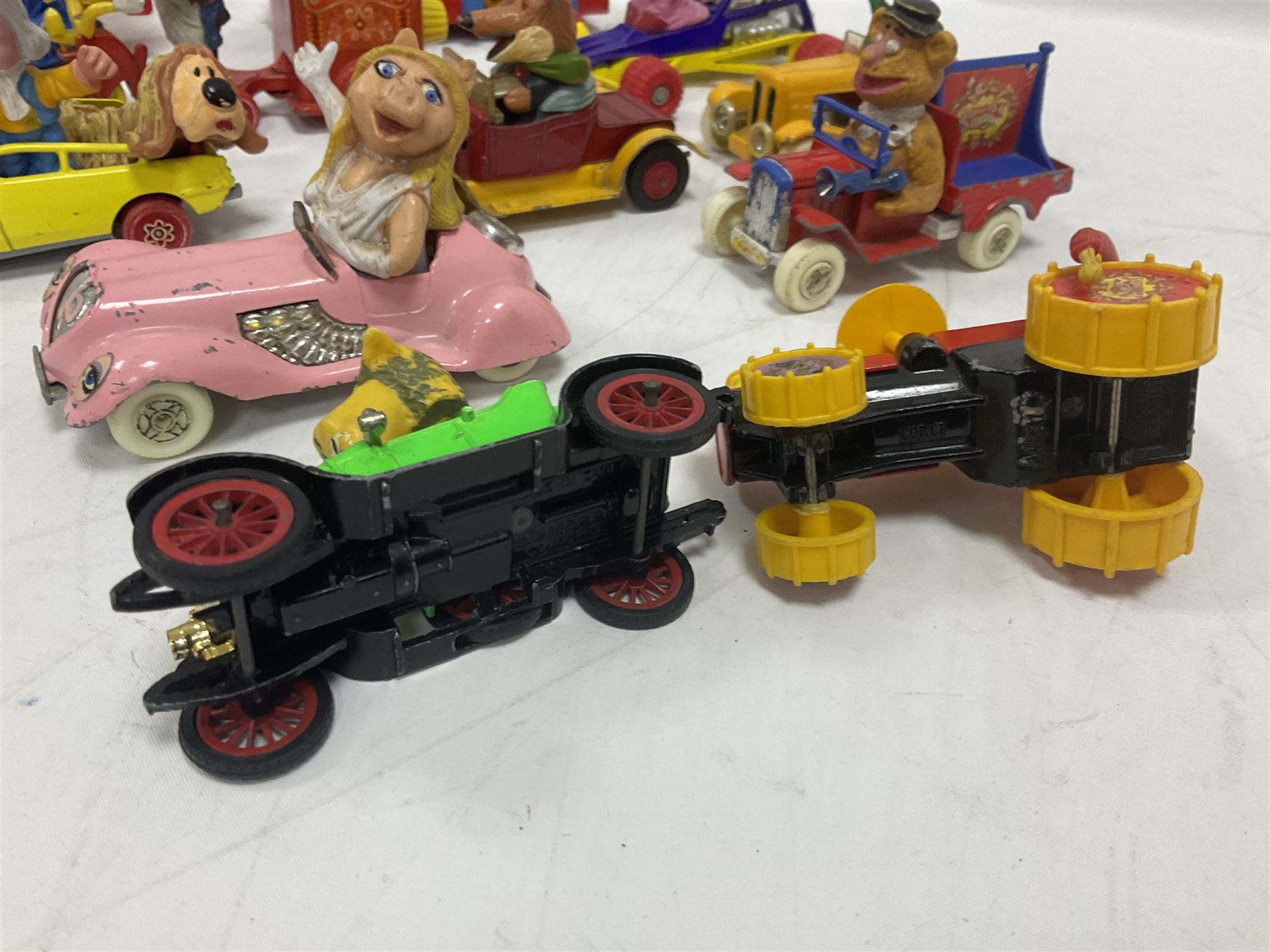 Corgi/Dinky - twelve unboxed and playworn TV/Film related die-cast models including Popeye Paddle Wagon; Dick Dastardly; Magic Roundabout; Muppets; Basil Brush; and Noddy (12)