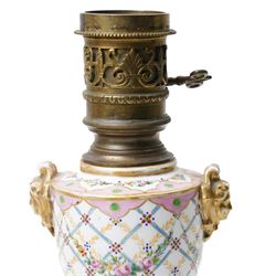 Pair of Sevres style table lamps, with pink and gilt floral decoration, apocryphal marks to bases, H32cm (2)