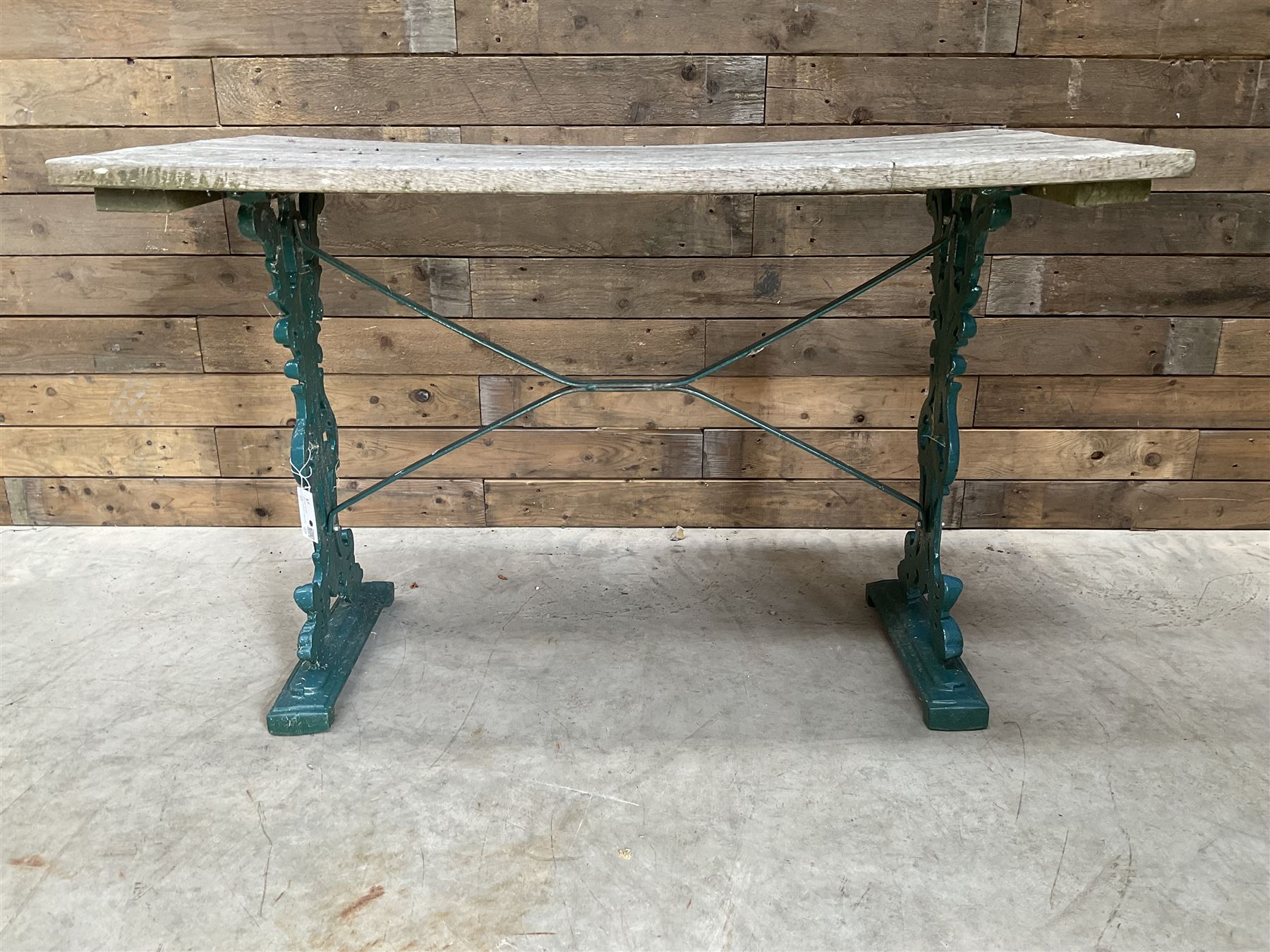 Early 20th century green painted ornate cast iron garden table, wood slatted top