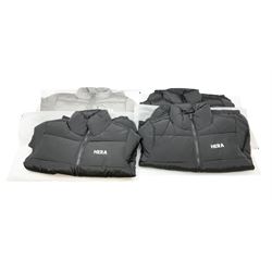 Four HERA Core puffer jackets comprising three medium black examples and one small grey example, brand new with bags
