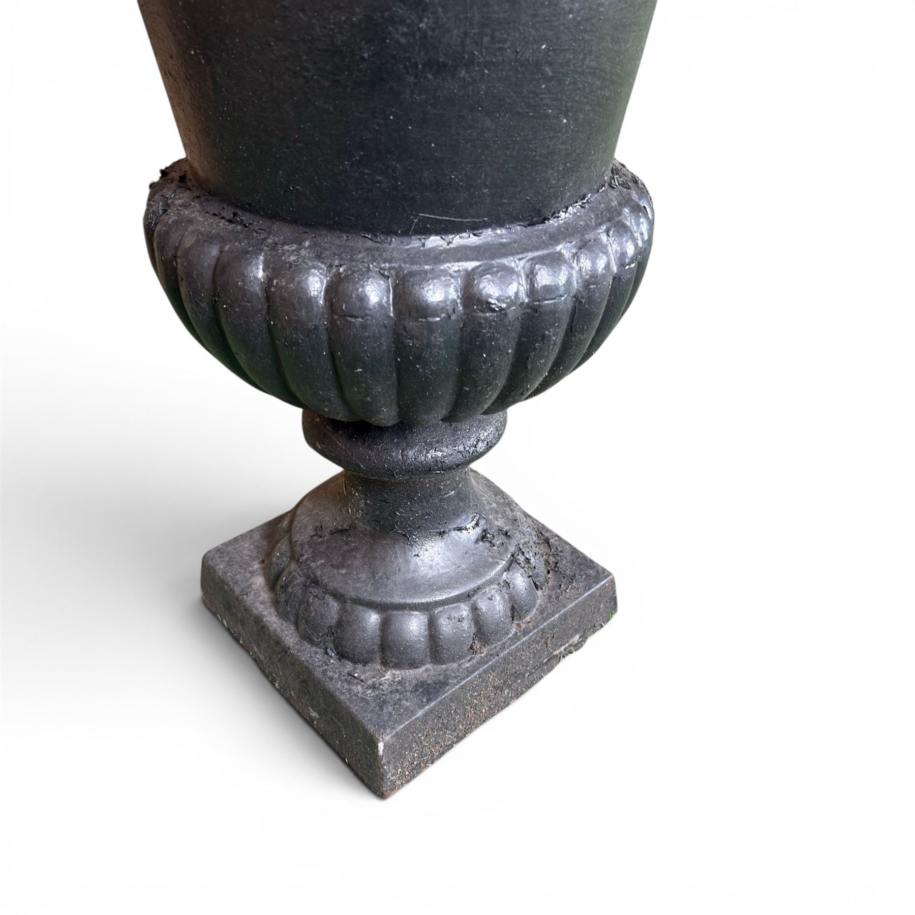 Victorian design cast iron garden centrepiece urn, egg and dart rim on tapering column, square plinth base, planted