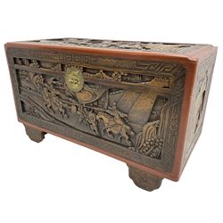 Mid-20th century Singapore camphor wood blanket chest, heavily carved depicting battle scenes and cityscapes 