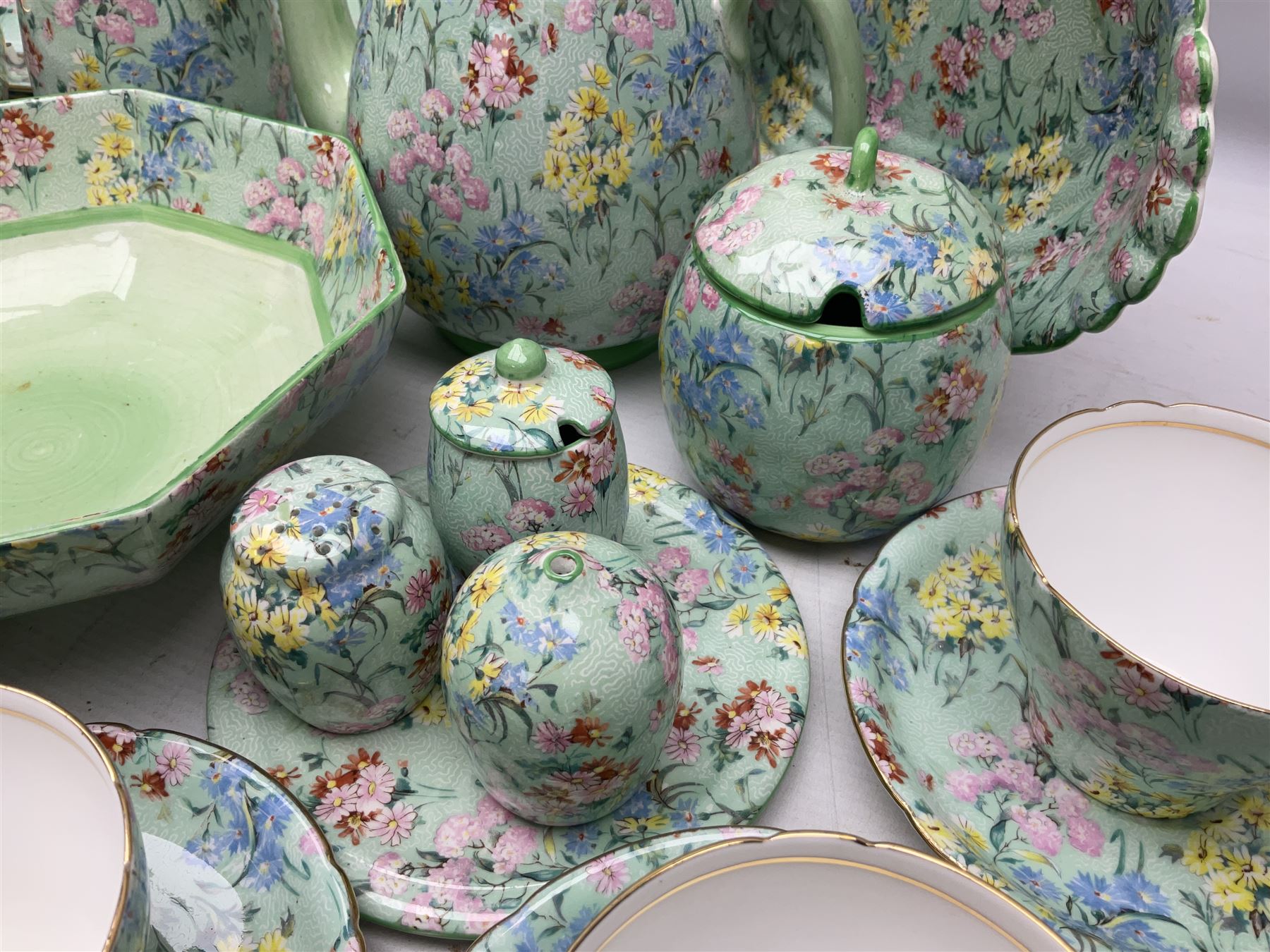 Shelley Melody pattern tea service for six, to include teapot, teapot stand, hot water jug, milk jug, covered sucrier, teacups and saucers, cake plates etc (31)