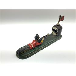 Very rare 19th century John Harper & Co. mechanical cast-iron money box, registered number 33821 patented 1885, inscribed on metal plaque 'Wimbledon Bank', based on the Queen's Trophy for shooting at Wimbledon, depicting a British Infantry man in red tunic and blue trousers lying on the ground using a gun to fire a brass coin launcher into a pill box with removable moving flag above L30cm