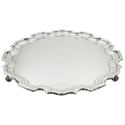 1930's silver salver, of circular form with Chippendale type rim and personal inscription, upon three scroll feet, hallmarked Walker & Hall, Sheffield 1933, D37cm, approximate weight 47.32 ozt (1472 grams)