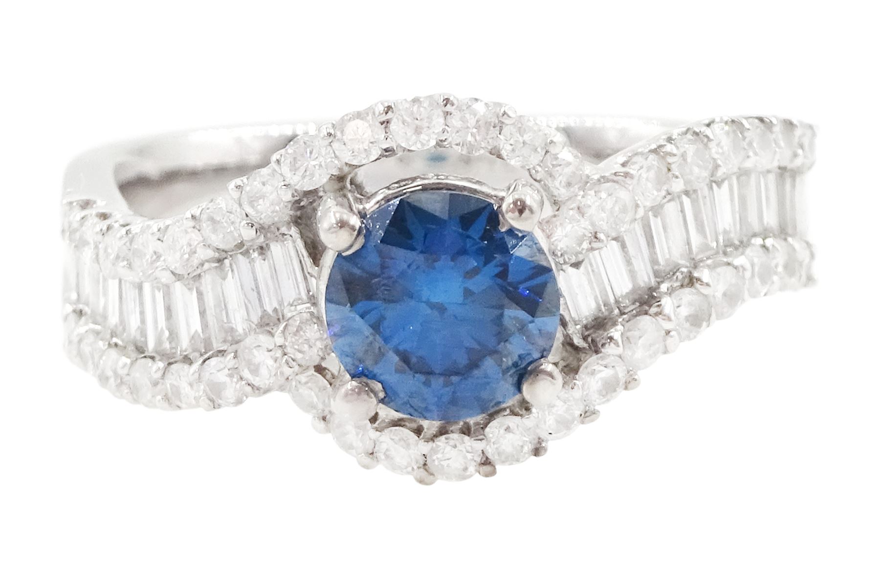 18ct white gold diamond crossover ring, the principal round brilliant cut fancy blue diamond of approx 0.75 carat, with round brilliant cut diamond surround and shoulders, stamped 750, total white diamond weight approx 0.60 carat