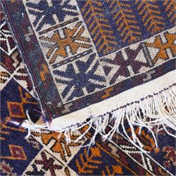 Persian Beluchi indigo ground prayer rug, overall geometric design (147cm x 85cm); together with a Bokhara rust ground rug (146cm x 101cm)