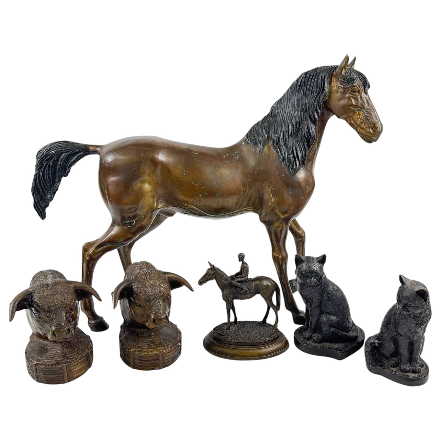 Brass bookends modelled as bulls, together with brass hose and three others 